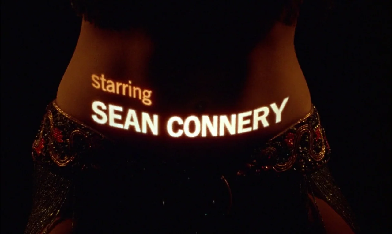 From Russia With Love (1963) movie still: closeup — A dark space serves as the backdrop for a projected text sequence. The words 'starring SEAN…
