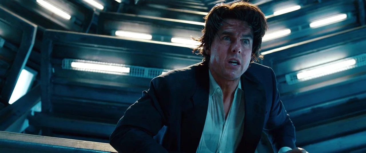 Mission: Impossible – Ghost Protocol (2011) movie still: medium — A dark, industrial corridor features repeating rows of horizontal fluorescent…