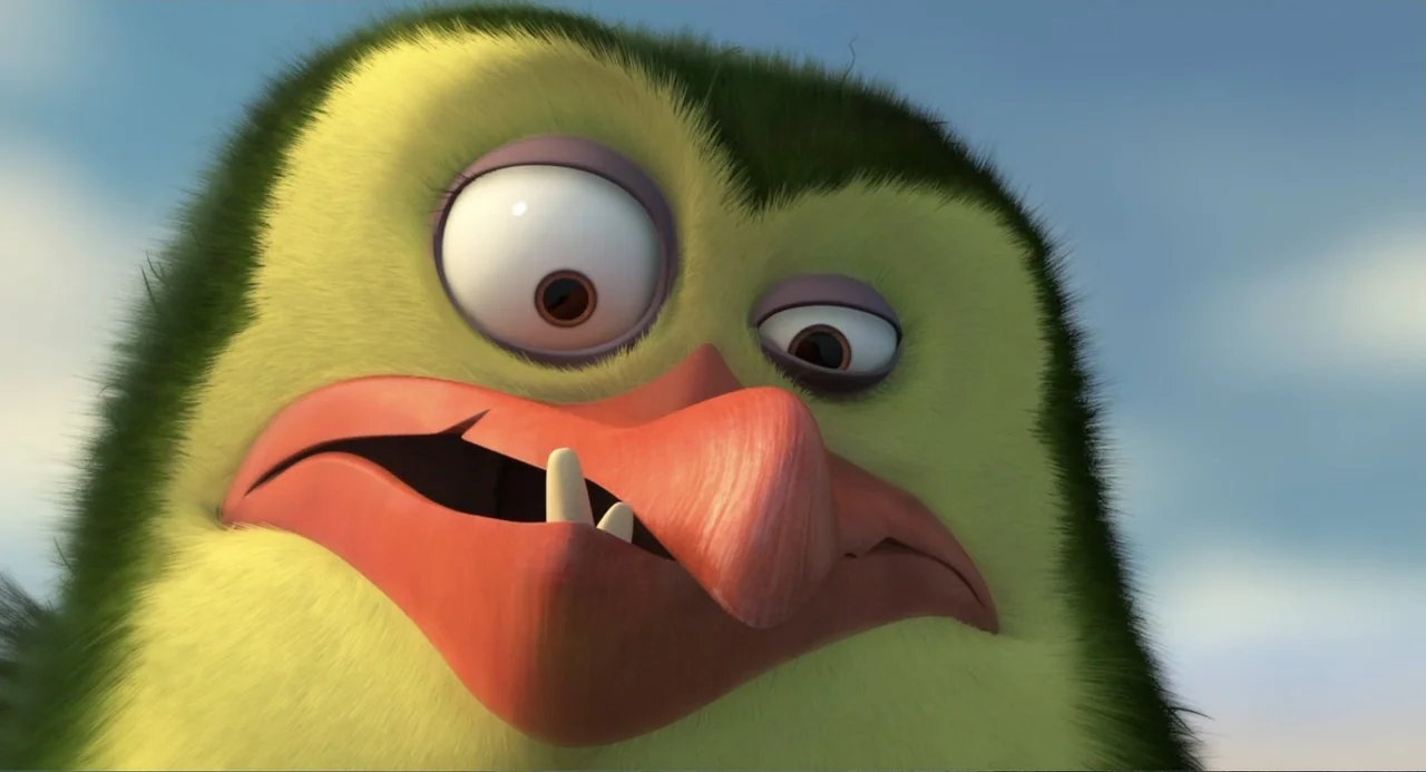 Penguins of Madagascar (2014) movie still: closeup — An extreme close-up of a fuzzy yellow bird with green feathers on its head. The bird has large…