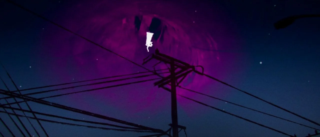 Archenemy (2020) movie still: wide — A dark, clear night sky features a large, glowing magenta swirling vortex formation. Thick black utility power…