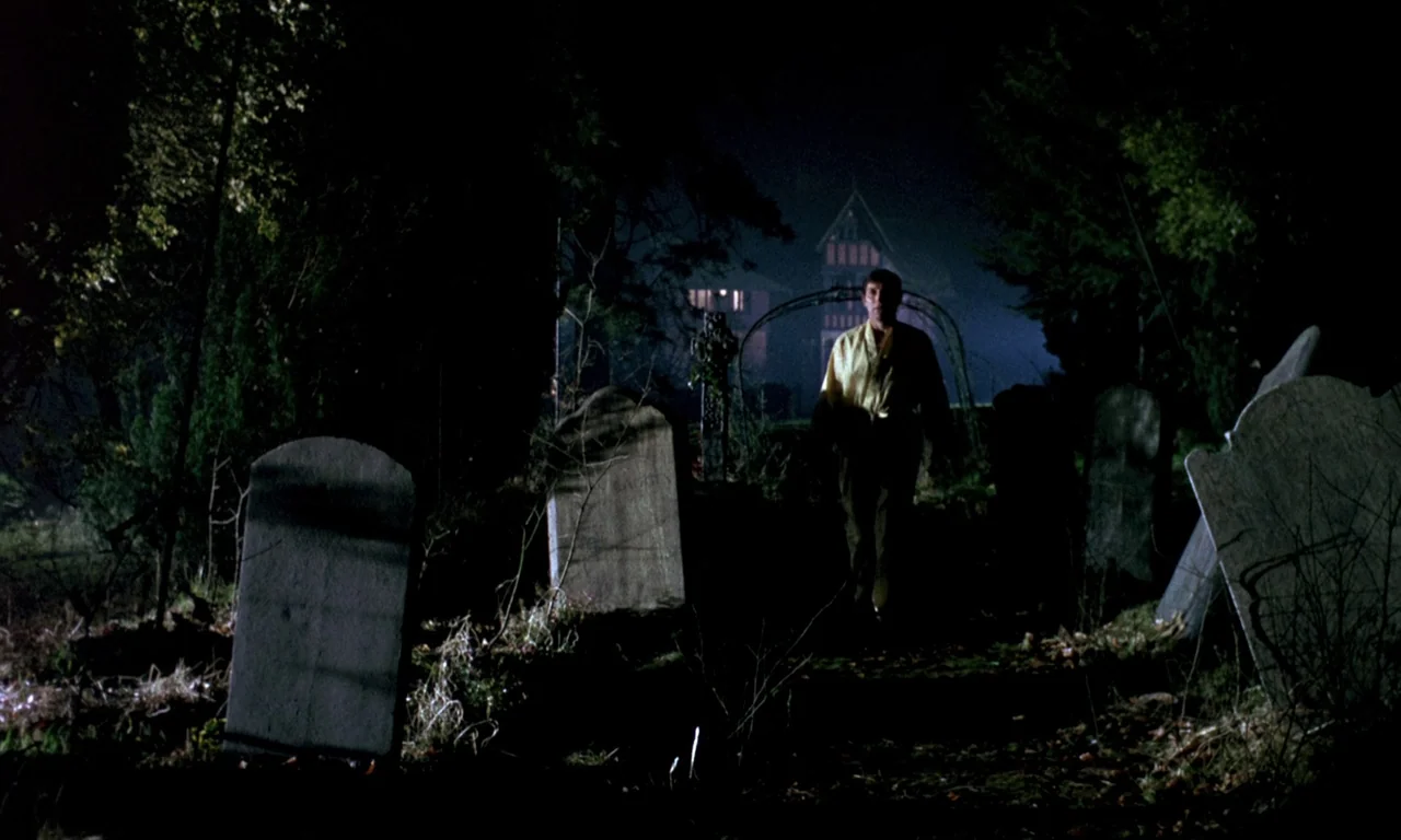 Curse of the Crimson Altar (1968) movie still: wide — A dark, overgrown cemetery features multiple upright stone headstones and a distant…