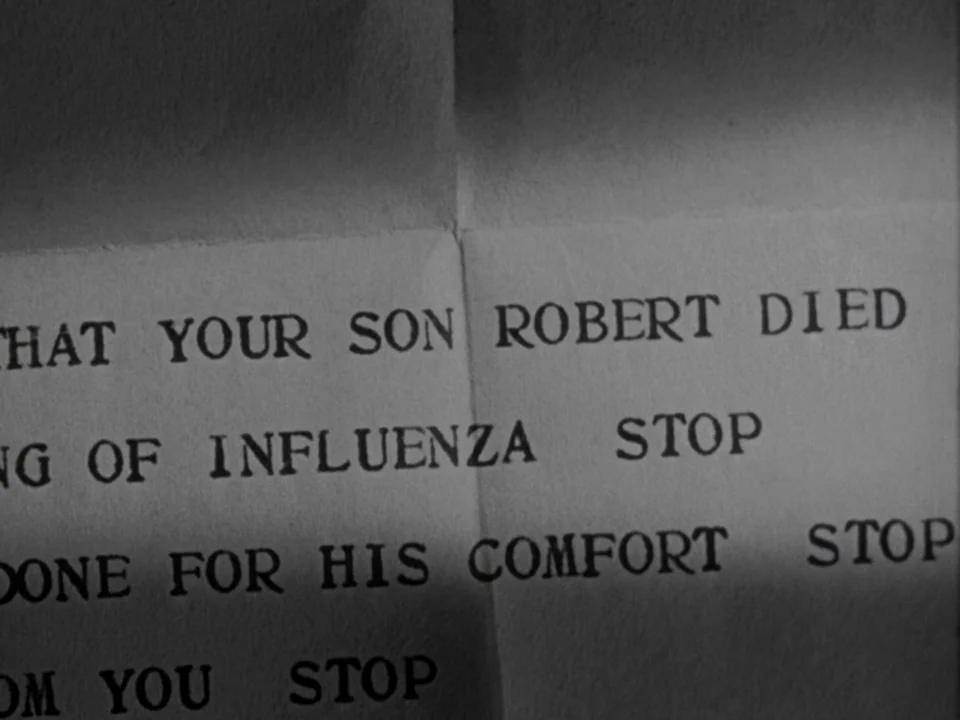 It’s A Wonderful Life (1946) movie still: closeup — A close-up view shows a piece of paper printed with typewriter text. The words on the page…