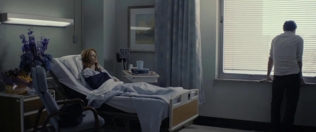 The Disappearance of Eleanor Rigby: Him (2014) movie still: wide — A hospital room features medical equipment, blue linens, and a large window with…