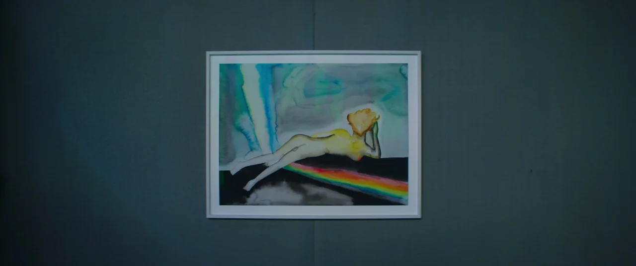 Inside (2023) (2023) movie still: medium — A framed watercolor painting is centered on a flat, dark teal wall. The painting depicts a stylized nude…