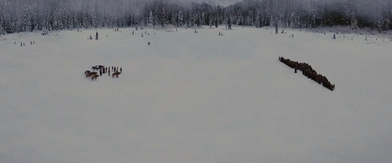 The Twilight Saga: Breaking Dawn – Part 2 (2012) movie still: wide — A vast, flat snowy plain is surrounded by a dense, snow-covered pine forest.…