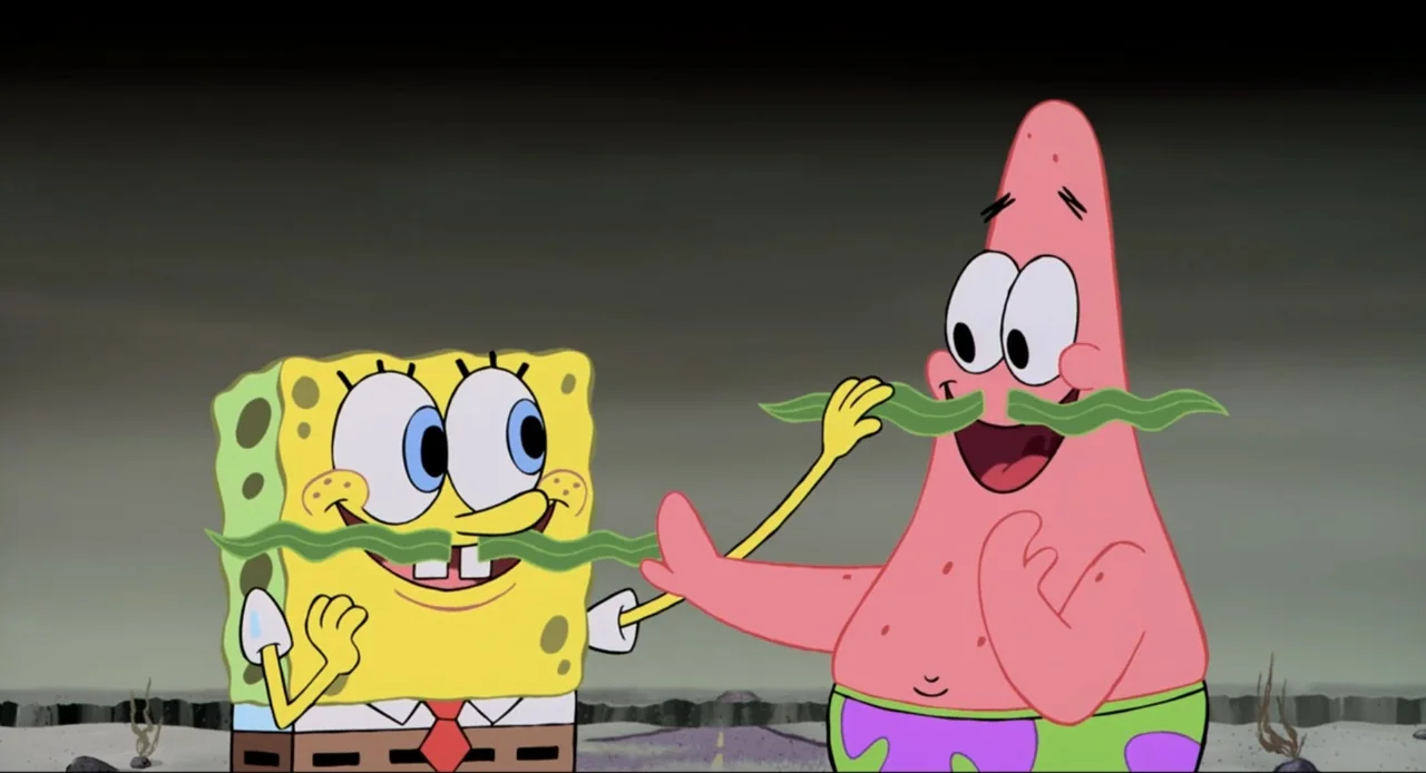 The SpongeBob SquarePants Movie (2004) movie still: medium — A desolate gray landscape with a visible road marking under an overcast sky. SpongeBob…