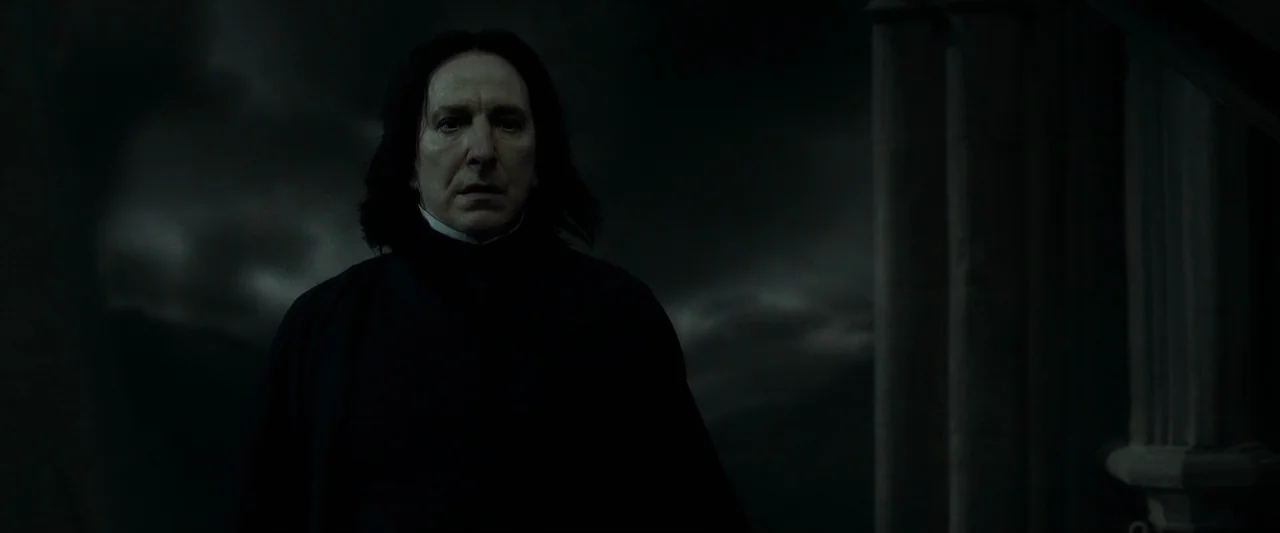 Harry Potter & The Half Blood Prince (2009) movie still: medium — A figure stands on a dark stone structure against a cloudy, ominous night sky. The…