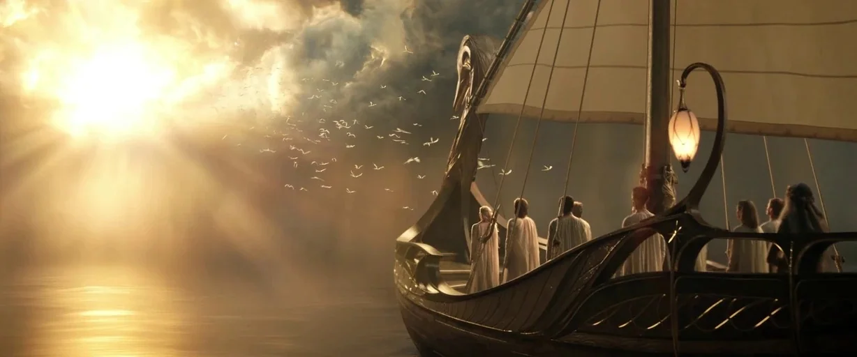 The Lord of the Rings: The Rings of Power (2022) movie still: wide — A tall wooden ship sails across a vast ocean toward a bright golden light.…