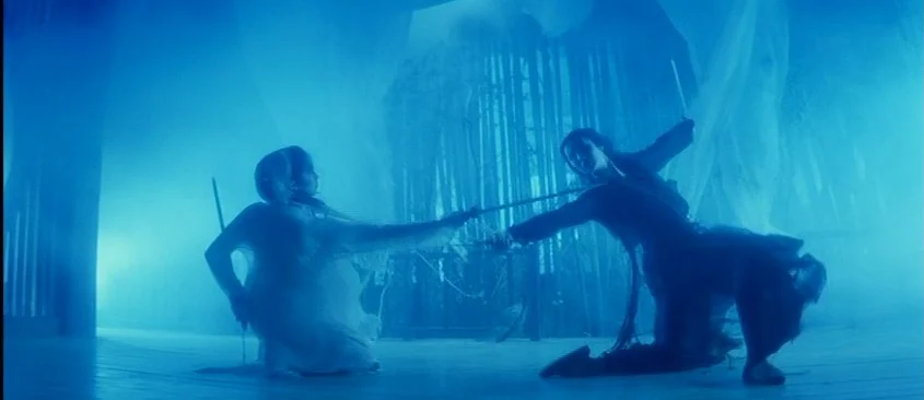Green Snake (1993) movie still: wide — A spacious hall filled with blue mist and sheer hanging fabric dividers. Two women in traditional robes…