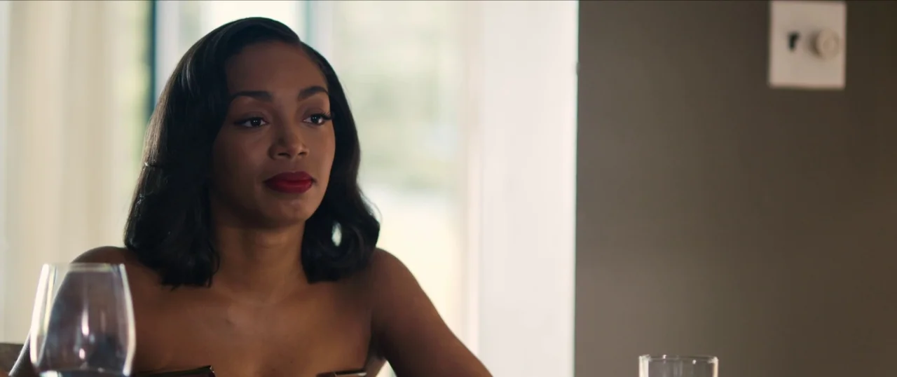 Da Sweet Blood of Jesus (2014) movie still: medium — A modern indoor space features a wall with a light switch and soft light. A woman with dark…