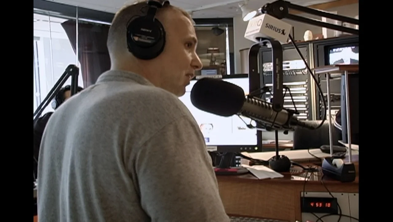 The Trials of Ted Haggard (2009) movie still: medium — A professional recording space contains electronic equipment and a broadcast microphone…