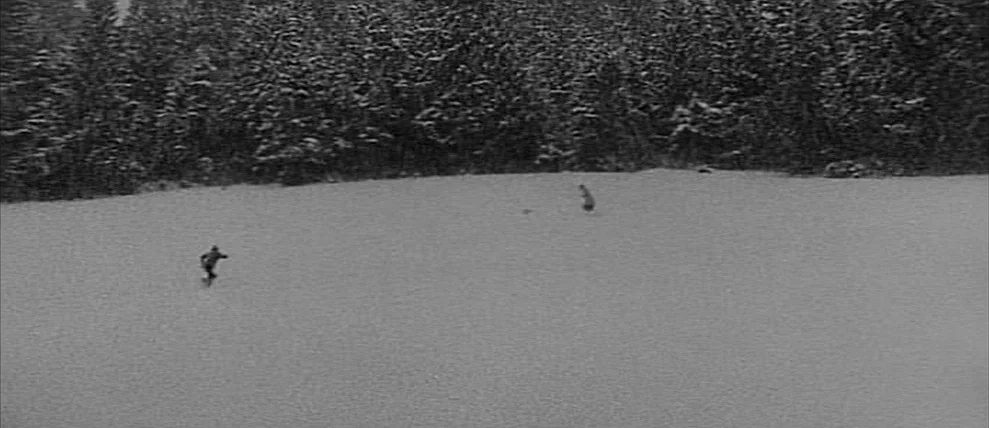 Shoot The Piano Player (Tirez Sur Le Pianiste) (1960) movie still: wide — A vast, open field covered in deep snow bordered by dense pine trees. Two…
