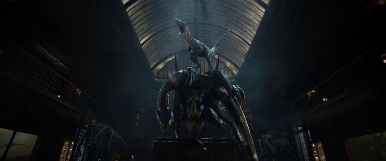 Jurassic World: Fallen Kingdom (2018) movie still: wide — A grand museum hall features a high glass ceiling and two levels of balconies. A central…